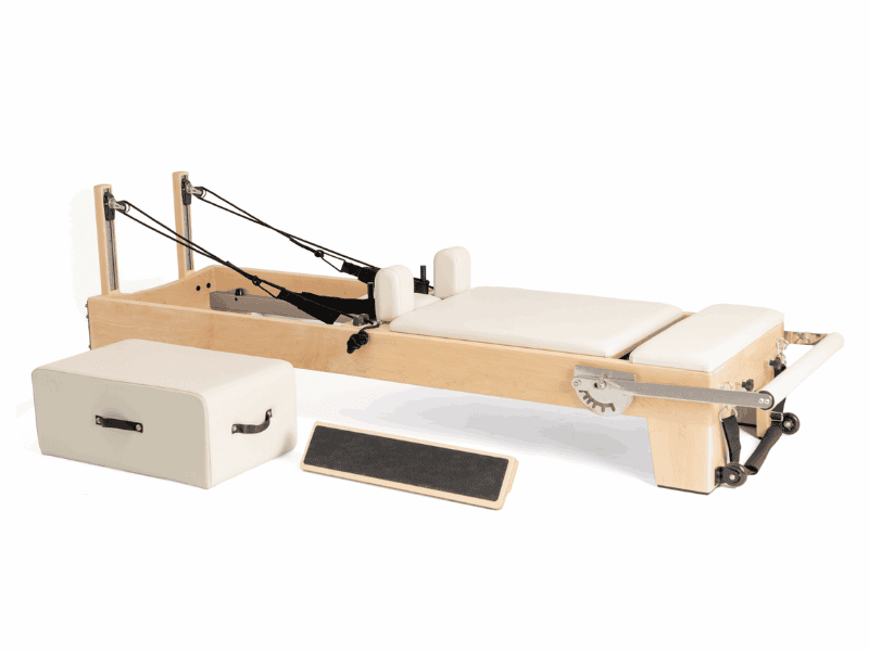 Wooden Pilates reformer with adjustable footbar and springs